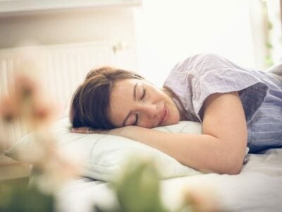 Sleeping woman on mattress