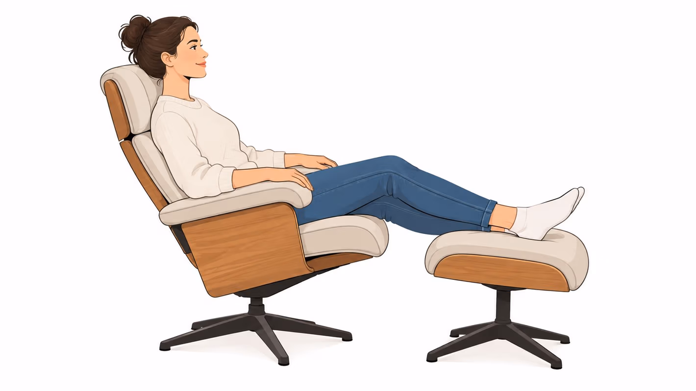 A relaxed woman with a hair bun sitting comfortably on a modern lounge chair and matching ottoman